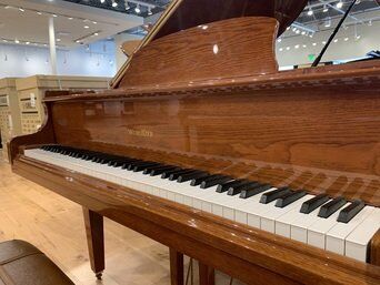 Wurlitzer baby grand piano keys close Wurlitzer baby grand piano keys close