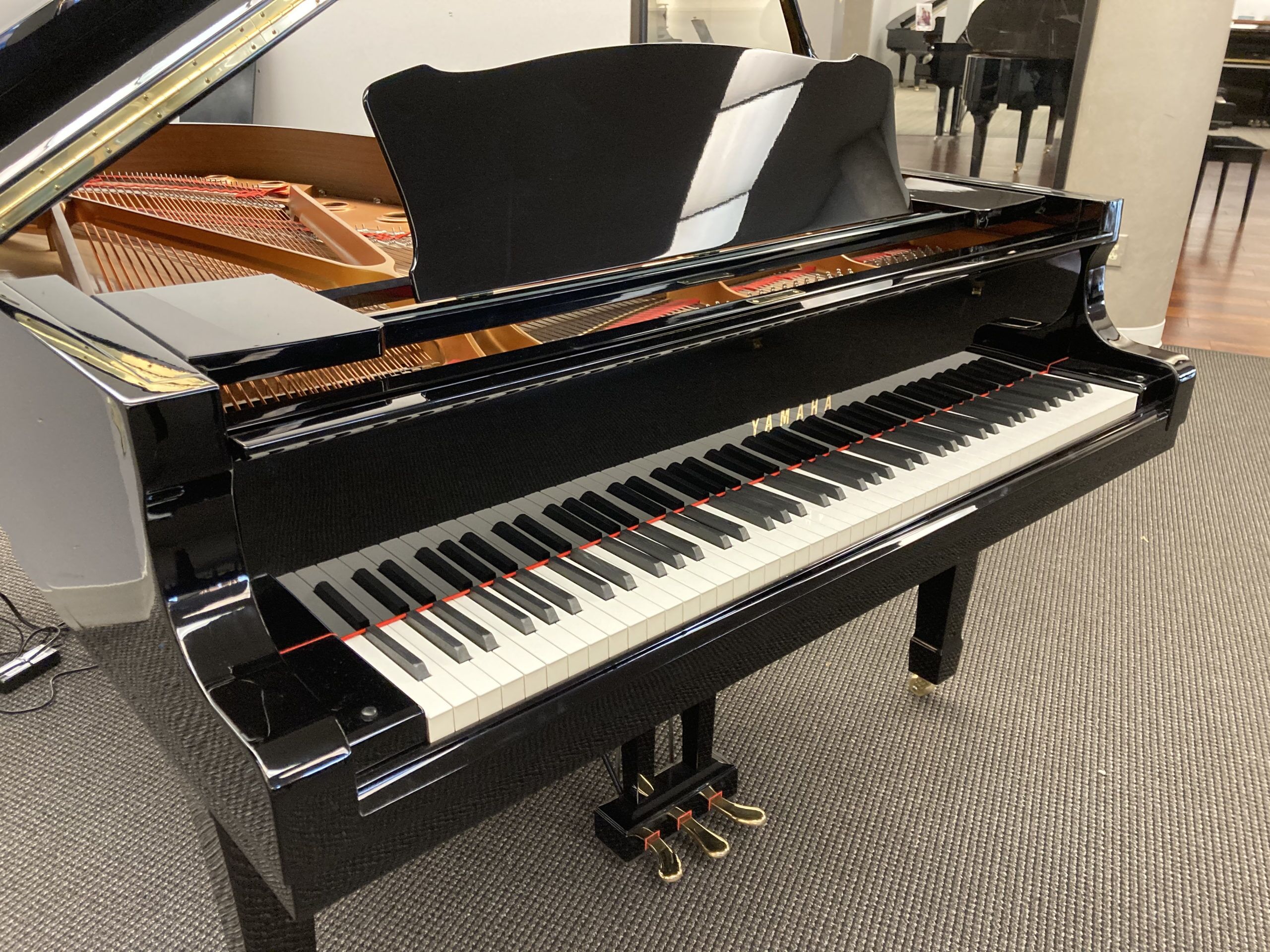 Yamaha DC6 grand piano front left angle view Yamaha DC6 grand piano front left angle view