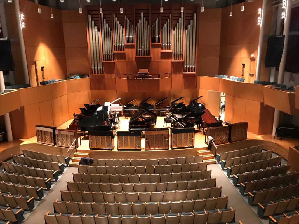 Concert hall with pianos on stage, birds eye view