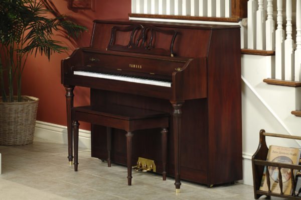 Yamaha M560S piano in home setting