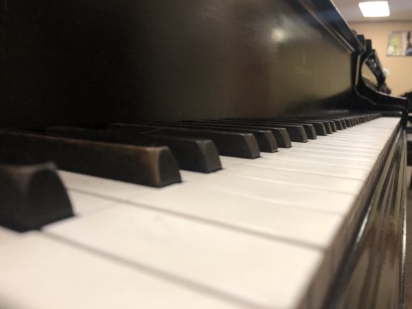 Steinway Model O grand piano keys closeup angle
