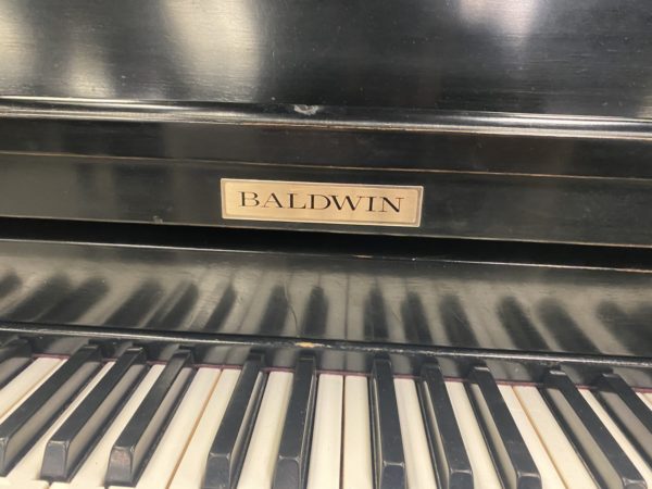 Baldwin Studio SE upright piano keys close up