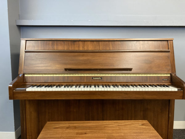 Used Baldwin Monarch upright piano front low angle view 338006
