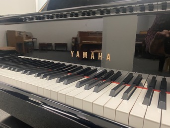 Yamaha G3PE grand piano keyboard close