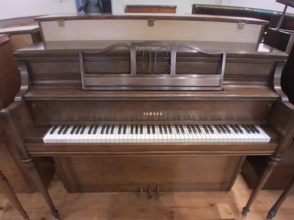 Yamaha upright piano with Sheraton legs
