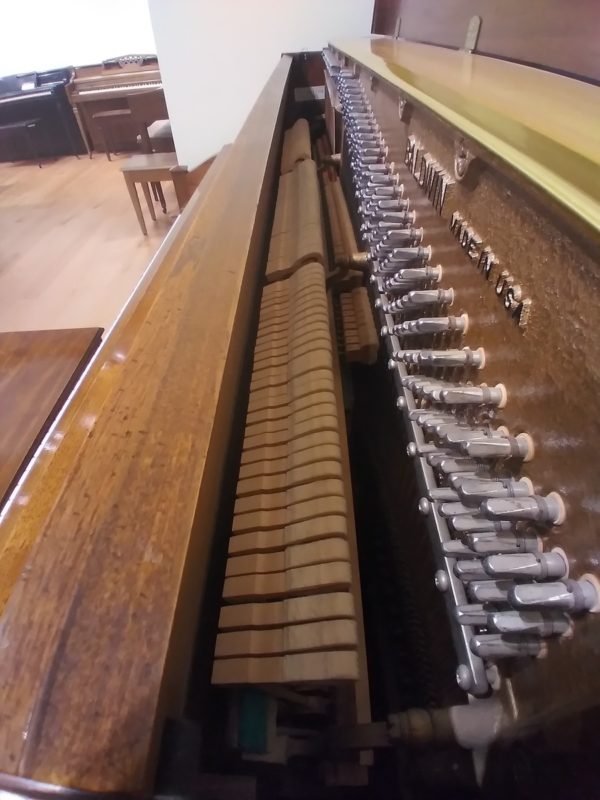 Baldwin 245C upright piano side view soundboard tuning pins