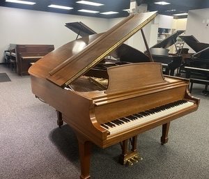 Steinway Model L Walnut grand piano left angle view