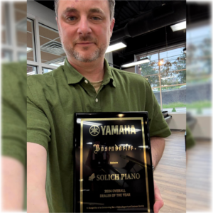Mike Loretto with Yamaha National Dealer of the Year Award at Solich Piano Pittsburgh
