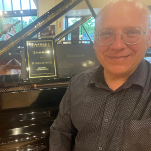 Nathan Anders with Yamaha National Dealer of the Year Award at Solich Piano Columbus