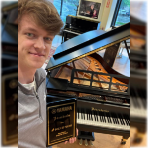 Will Keller with Yamaha National Dealer of the Year Award at Solich Piano Columbus